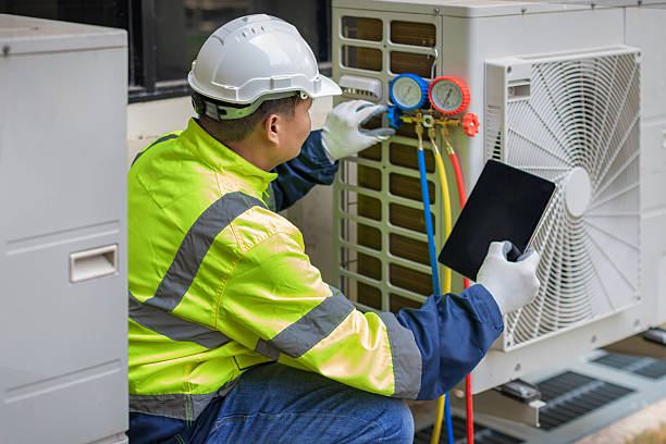 Professional Heat Pump Repair technician working in Springville, AL